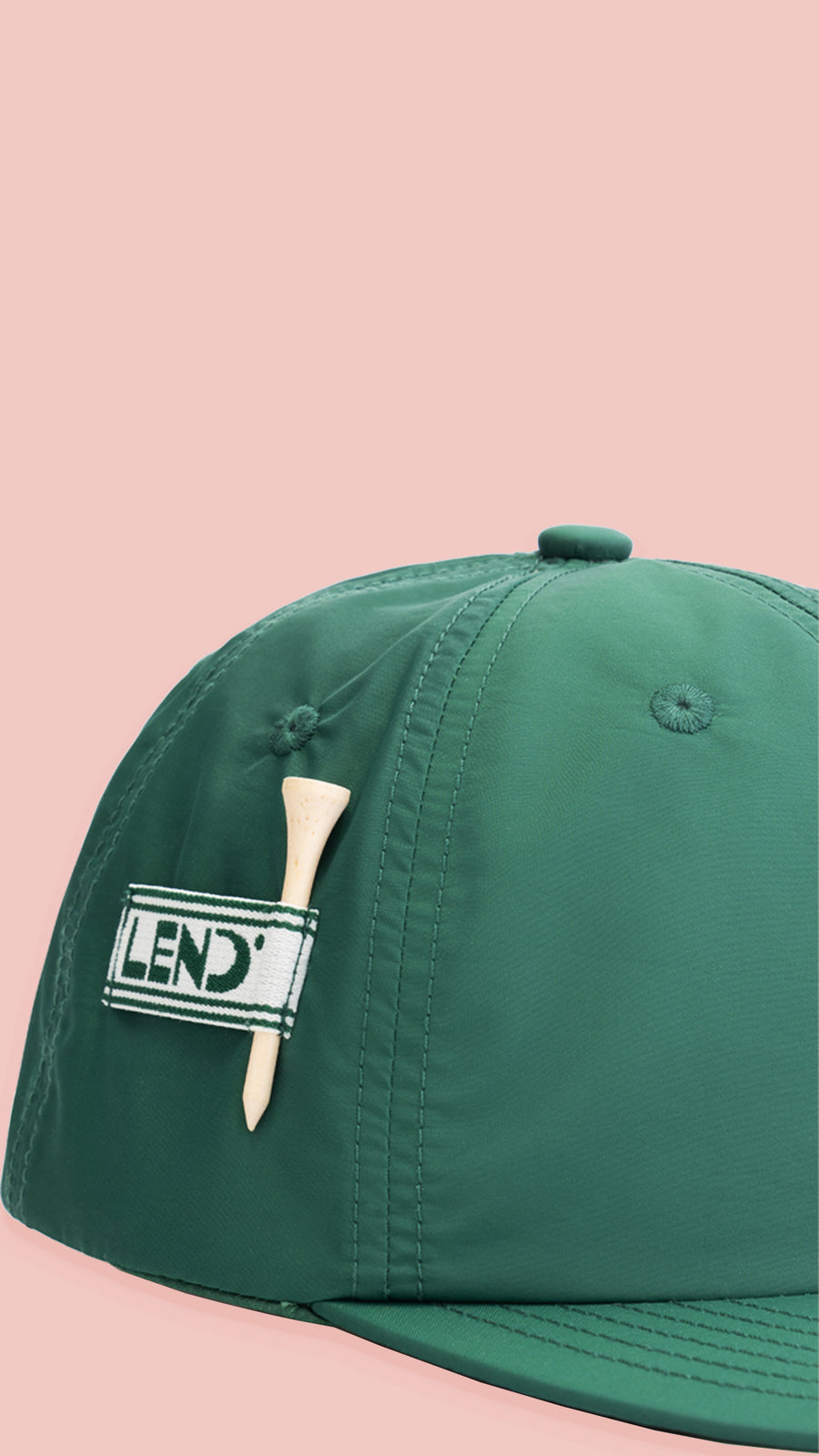 detail shot of lend water repellent green five panel cap with golf tee holder